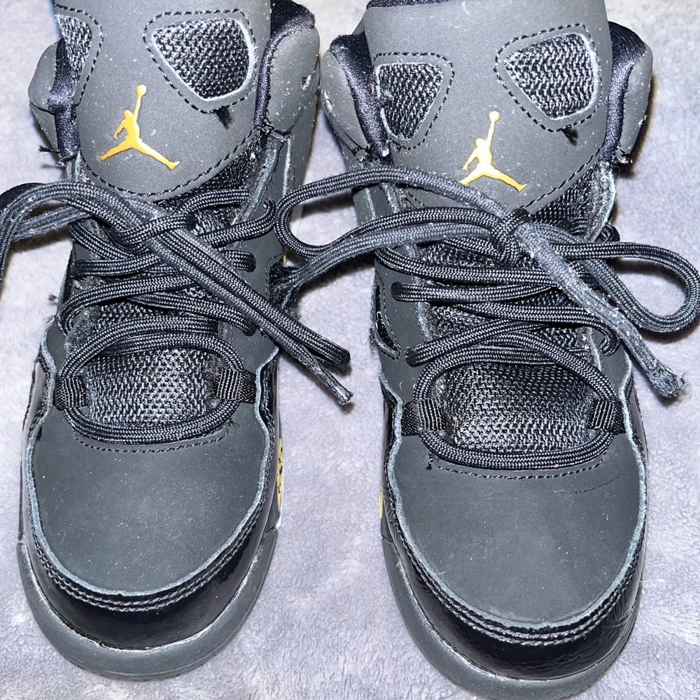 Kids Black and Gold Jordan Sneakers